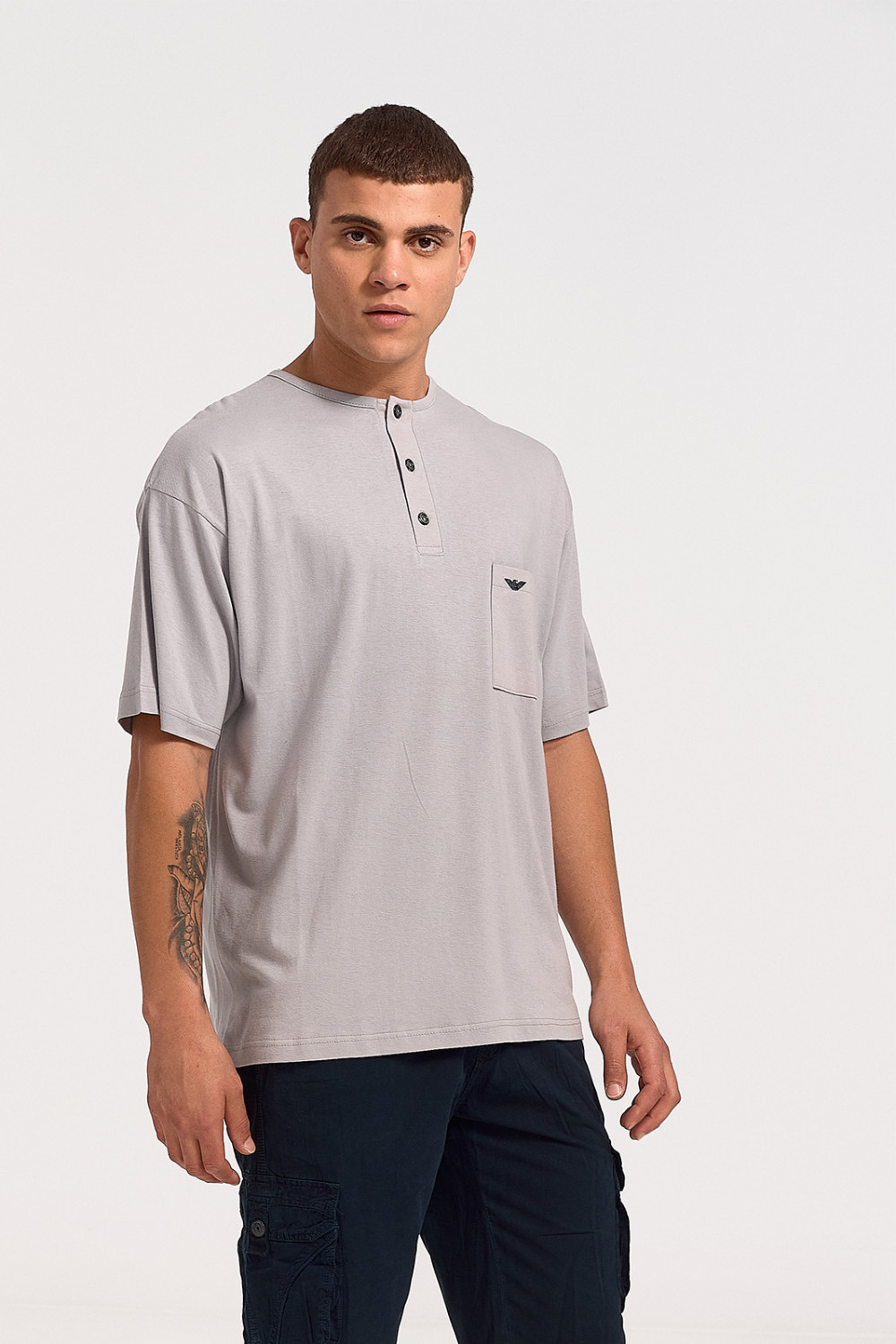 Short-sleeved LION blouse with button and pocket