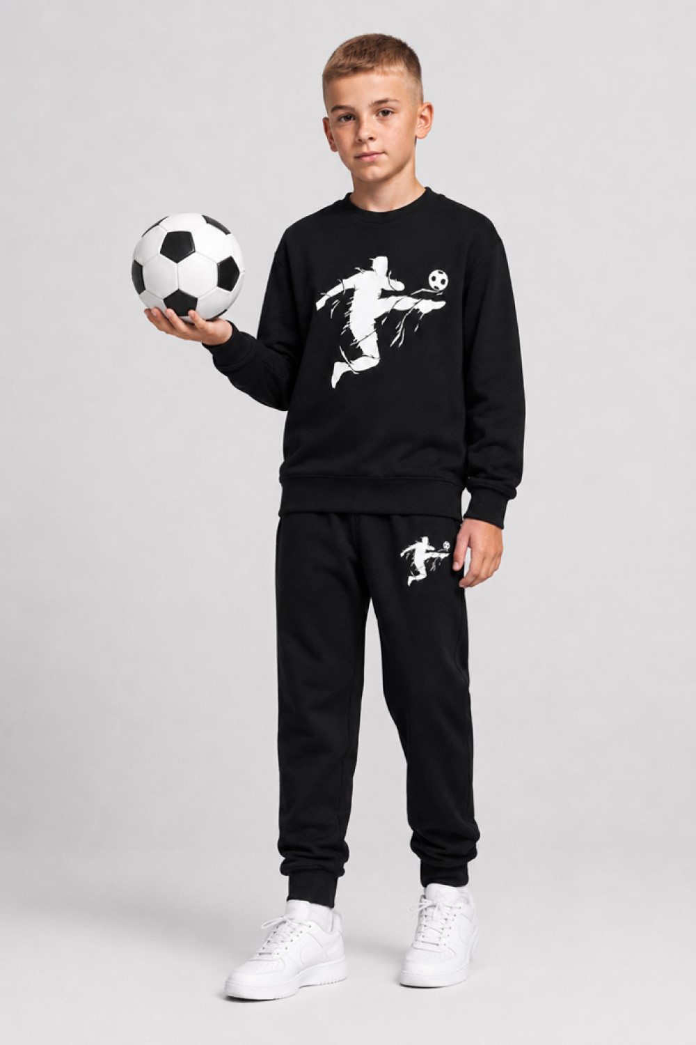 TRAX boys' black tracksuit set with football-player print
