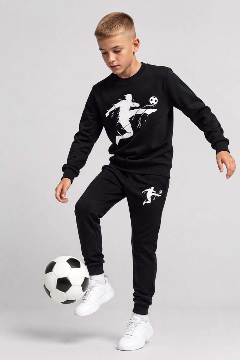 TRAX boys' black tracksuit set with football-player print